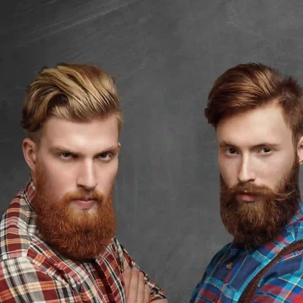 Two men with pompadour hairstyles, long hair, and beards standing next to each other.