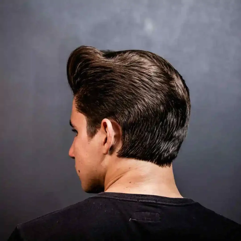 A man with a black shirt and a short haircut, showcasing haircuts for men with diamond face.