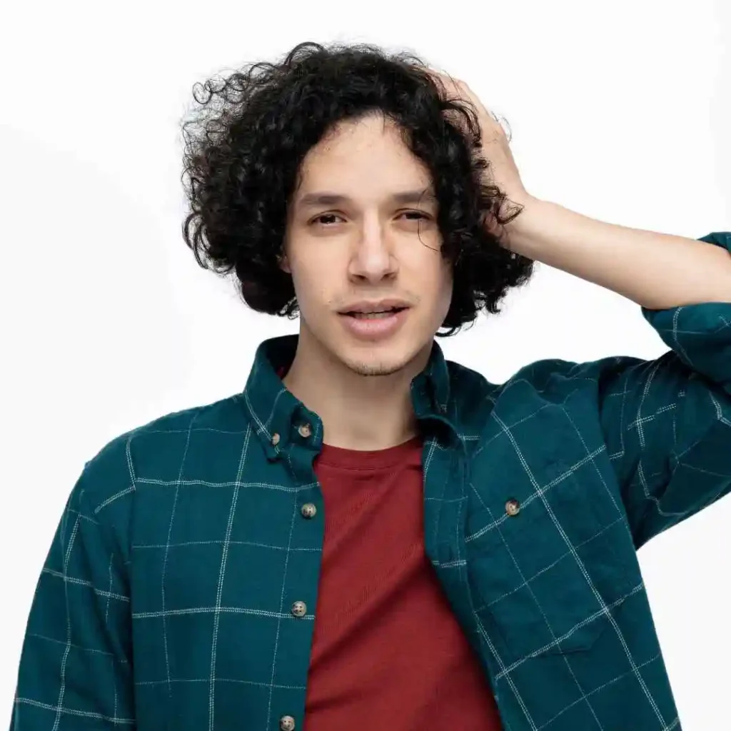 a young man with curly hair