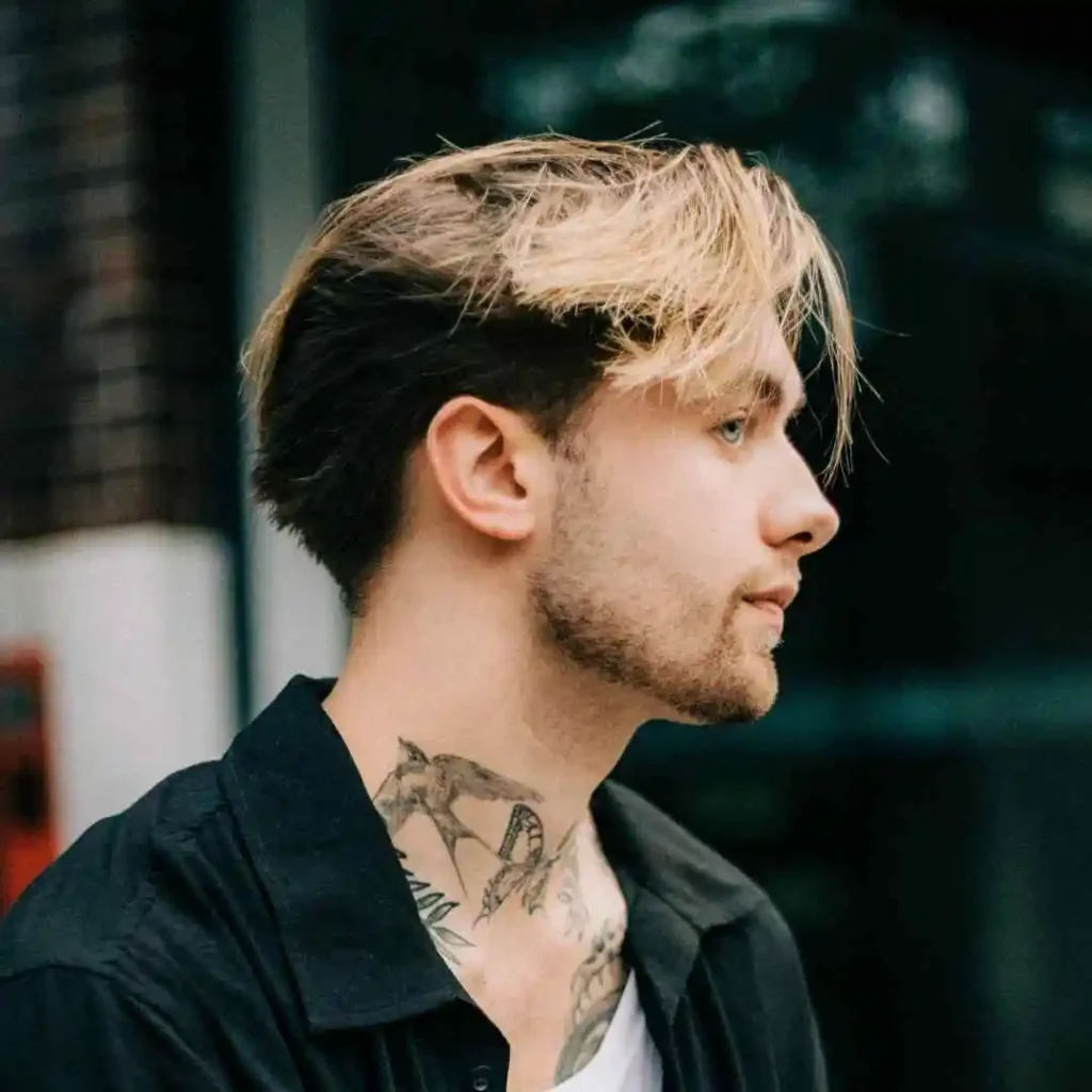 a man with tattoos on his neck