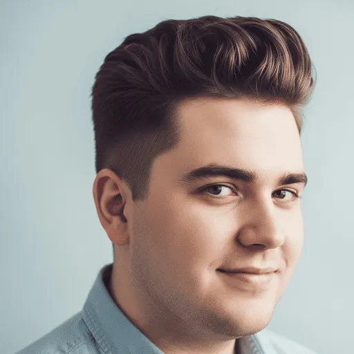 A young man with stylish, textured hair styled in one of the flattering men hairstyles for round face shapes, standing against a light blue background and wearing a denim shirt.