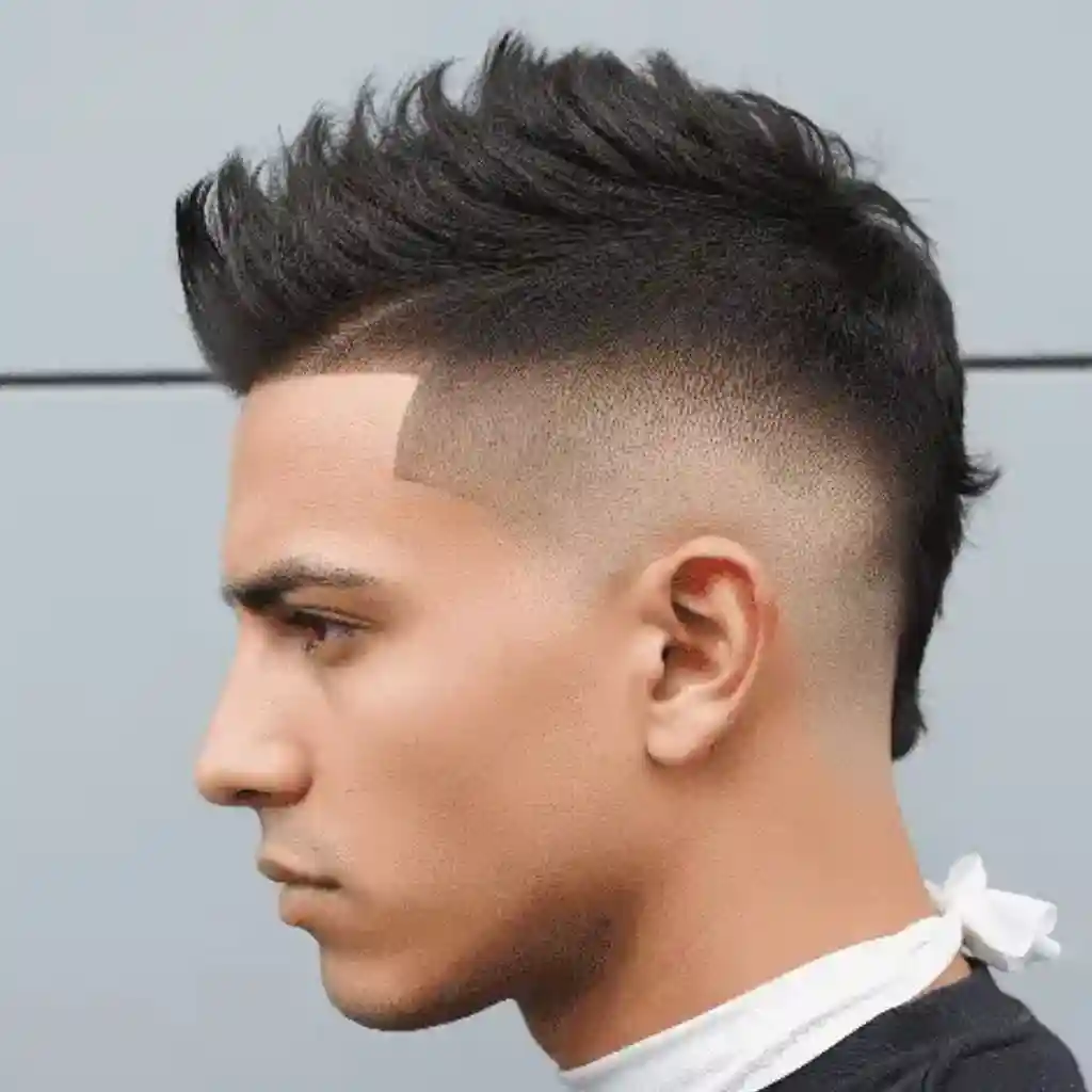 A person with a stylish, spiked haircut featuring a faded undercut, showcasing one of the modern men short hairstyles, wearing a white scarf around their neck, against a plain background.