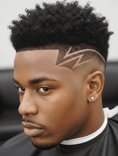 A man with curly black hair styled with a lightning bolt design shaved into the side of his head.