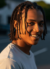 young man with a Cornrows or Dreadlocks hairstyle