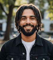 27 Best Protective Hairstyles for Men- On-trend and Comfortable 6 A man with dreadlocks, representing a popular protective hairstyle choice for men, highlighting personal style and culture
